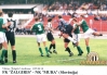 Prizor s tekme Žalgiris Mura, ki je bila odigrana 10. avgusta 1995 v Vilni. Gneča v kazenskem prostoru Mure in posredovanje vratarja Štefana Černjaviča.